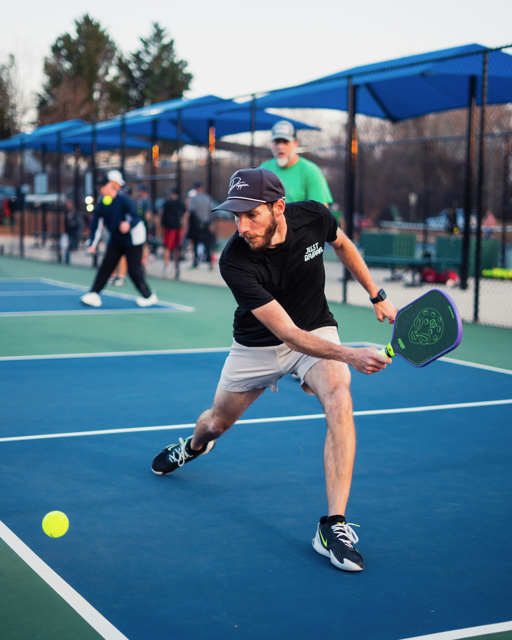 Brent Alexander reaching for a pickleball shot at Gower Park in Greenville, South Carolina